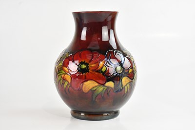 Lot 7 - WALTER MOORCROFT; a large baluster shaped vase...