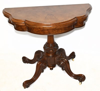 Lot 1567 - A Victorian walnut serpentine shaped card table.