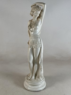 Lot 139 - A large cream painted plaster figure of a semi-...