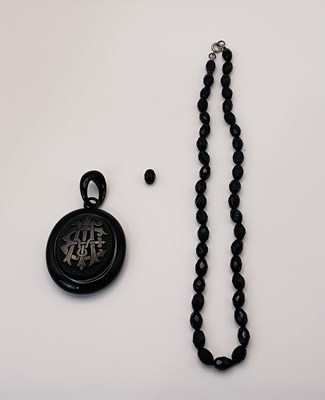 Lot 505 - An Edwardian Whitby jet mourning pendant,...