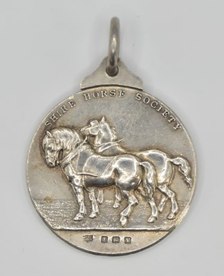 Lot 1137 - A silver medallion on necklace hoop, given by...