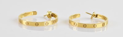 Lot 228 - CARTIER; a pair of 18ct yellow gold 'Love'...