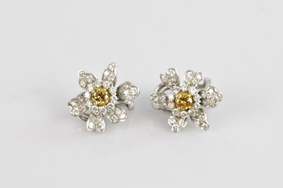 Lot 229 - A pair of white metal diamond set cluster ear...