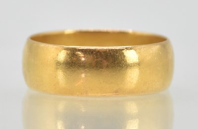 Lot 1190 - A 22ct yellow gold band ring, size P, approx 6....
