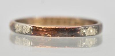 Lot 1294 - A 22ct yellow gold band ring, with double...