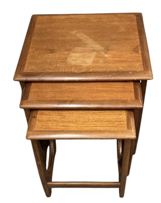 Lot 65 - G PLAN; a teak mid century nest of three...