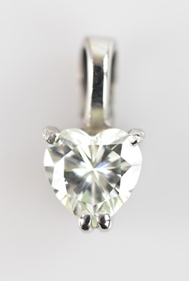 Lot 353 - A heart shaped diamond pendant, set in a white...