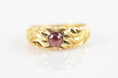 Lot 546 - An 18ct yellow gold ring with decorated...