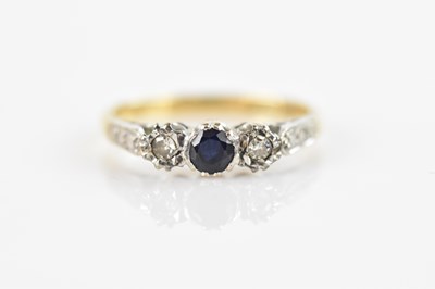 Lot 547 - A 18ct white gold three stone ring set with a...