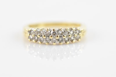 Lot 548 - An 18ct yellow gold ring set with melee of...