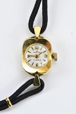 Lot 1072 - BUCHERER; an 18ct gold cased lady's cocktail...
