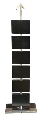 Lot 99 - A modern contemporary ebonised and chrome...