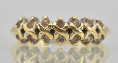 Lot 1260 - A 9ct yellow gold double row diamond set ring,...
