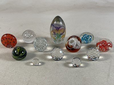 Lot 179 - A quantity of various glass paperweights...