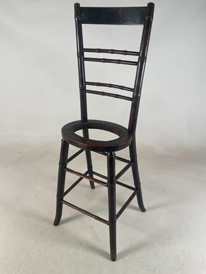 Lot 679 - A 19th century mahogany correction chair with...
