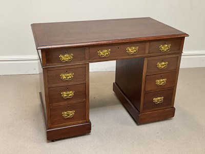 Lot 1041 - An Arts & Crafts oak pedestal desk, with an...