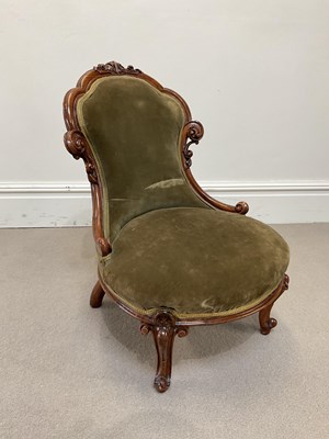 Lot 1136 - A Victorian walnut nursing chair, with green...