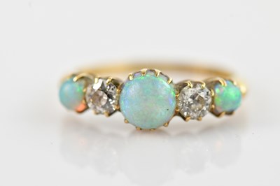 Lot 529 - A Victorian yellow metal diamond and opal five...