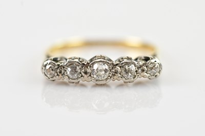 Lot 615 - A yellow and white metal diamond illusion set...