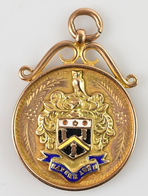 Lot 32 - A 9ct yellow gold and enamel medal, decorated...