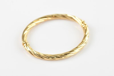 Lot 98 - An Italian yellow metal textured hinged snap...