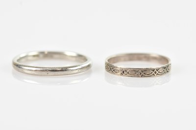 Lot 674 - A white metal wedding band, tests as platinum...