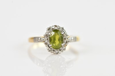 Lot 632 - A yellow and white metal diamond and peridot...