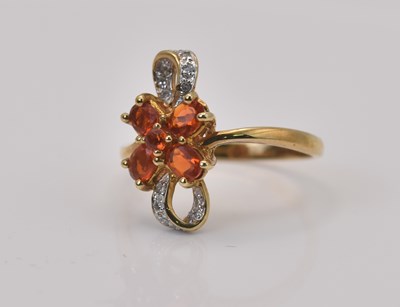 Lot 489 - A 9ct yellow gold fire opal and diamond ring,...