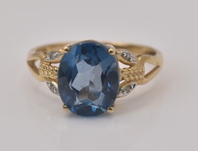 Lot 490 - A 9ct yellow gold gem and diamond set ring,...