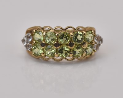 Lot 470 - A 9ct yellow gold peridot and white topaz...