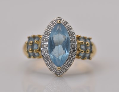 Lot 472 - A 9ct yellow gold Swiss blue topaz and diamond...
