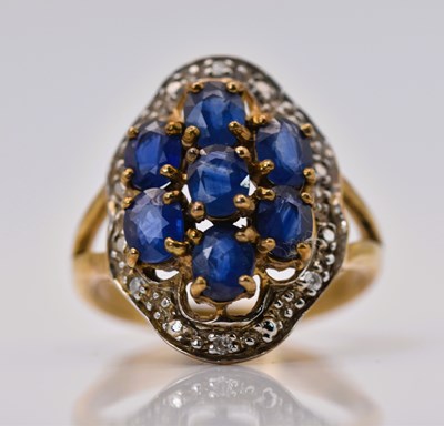 Lot 451 - A 9ct yellow gold sapphire and diamond cluster...