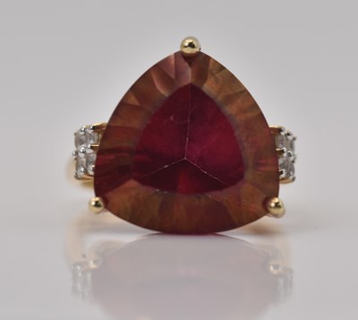 Lot 466 - A 9ct yellow gold cherry topaz and white...