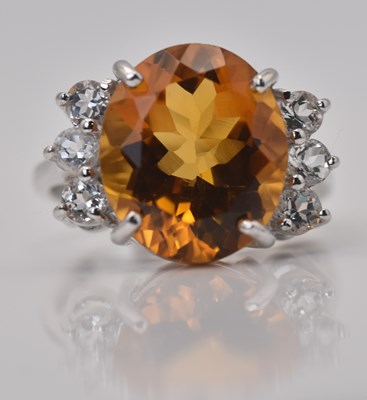 Lot 465 - A 9ct white gold large oval citrine and white...
