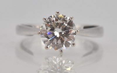Lot 1166 - An 18ct white gold diamond solitaire ring, the...