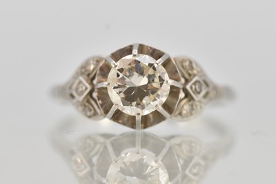 Lot 1238 - A platinum diamond solitaire ring, the central...