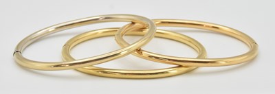 Lot 1442 - A set of three 18ct yellow gold oval snap...