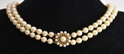 Lot 1365 - A double strand cultured pearl necklace, with...