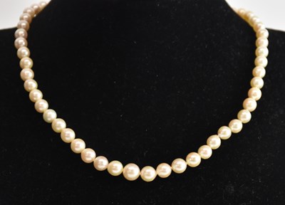 Lot 1473 - A single strand cultured pearl necklace, with...