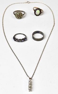 Lot 845 - A 9ct yellow gold and silver ring set with an...
