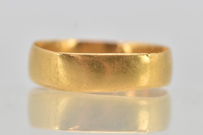 Lot 1210 - A 22ct yellow gold band ring, size N, approx 2....