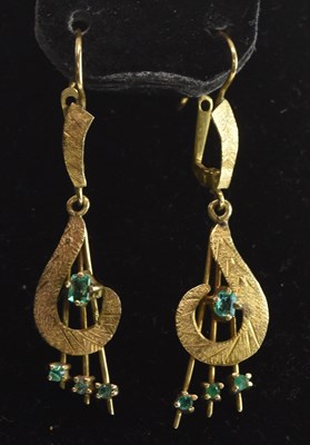 Lot 1416 - A pair of 18ct yellow gold and emerald set...