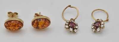 Lot 1417 - A pair of 14ct yellow gold garnet and diamond...