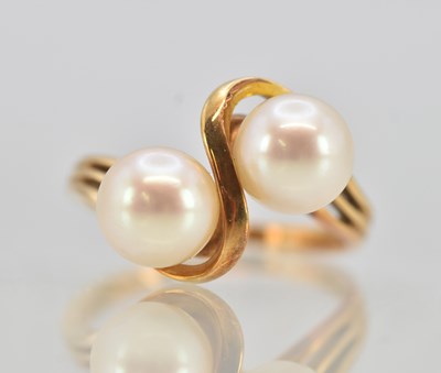 Lot 1250 - A 14ct yellow gold cultured pearl crossover...