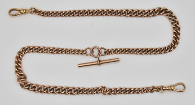 Lot 1142 - A 9ct rose gold watch guard, with central...