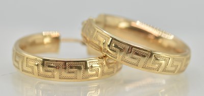 Lot 1413 - A pair of 9ct yellow gold large hoop earrings...