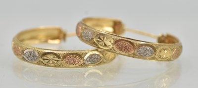 Lot 1418 - A pair of 9ct gold hoop earrings with white,...