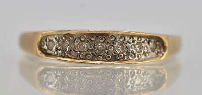 Lot 1326 - A 9ct yellow gold ring, with a small strip of...