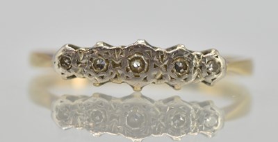 Lot 1252 - An 18ct yellow gold diamond set ring, set with...