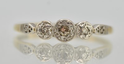 Lot 1253 - An 18ct yellow gold ring, with three graduated...